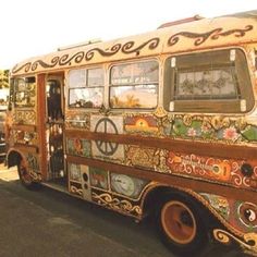 an old bus is decorated with colorful designs