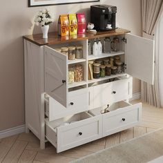 a white cabinet with drawers and coffee maker