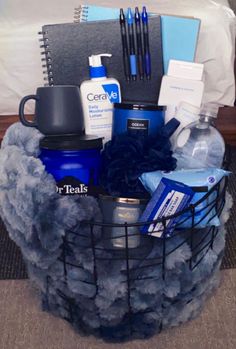 a basket filled with items sitting on top of a bed