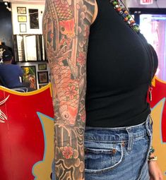 a woman with a tattoo on her arm