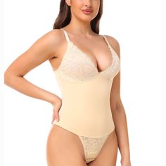 A sculpting fit that’s always a hit. This invisible under everything bodysuit tucks in your tummy while lifting the butt. The shapewear is designed to hold your core while still giving you a comfortable fit and doesn’t make you feel restricted. The supportive bust has a lace overlay with adjustable straps with a contouring belt leading to lace crotch. Color: Black & BeigeStraps: Adjustable Shoulder StrapsSilhouette: SlimmingCrotch: Lace Crotch With Adjustable HooksBra: Lining, Lace, 2/3 cup , wi Underbust Shapewear Bodysuit, Sculpting Push-up Shapewear Bodysuit, Elegant Solid Supportive Shapewear, Solid Sculpting Shapewear, Bra-friendly, Elegant Supportive Solid Shapewear, Solid Sculpting Bra Friendly Shapewear, Sculpting Push-up Shapewear With Lined Body, Solid Sculpting Underbust Shapewear, Solid Sculpting Shapewear, Bra Friendly