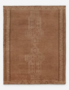 a brown rug with an intricate design on it