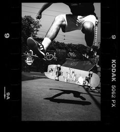 a man riding a skateboard up the side of a ramp