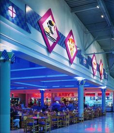 the inside of a restaurant with tables and chairs