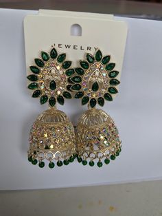 Indian style jhumka earrings. Vintage style. Costume jewellery. Bollywood Style Green Bridal Earrings For Party, Green Drop Earrings Jhumkas For Festivals, Green Drop Jhumkas For Festivals, Green Chandbali Danglers For Party, Heavy Drop Jhumkas, Green Latkan Earrings For Party, Green Earrings With Latkans For Party, Green Bollywood Bridal Earrings For Party, Festive Metal Chandbalis For Party