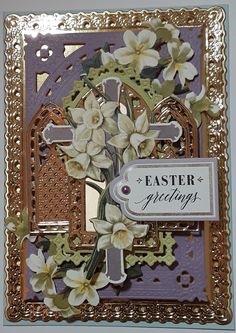 an easter card with flowers and a cross on the front, in gold trimming