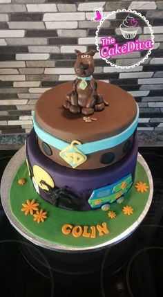 a three tiered cake with an animal on top