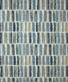 a blue and green rug with vertical stripes