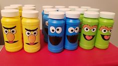 the sesame street bottles are lined up on the table