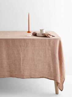 an empty table with a candle on it