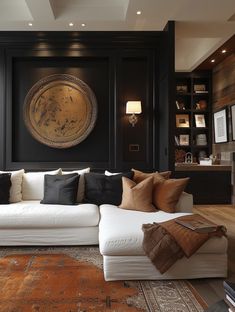 a living room filled with furniture and lots of pillows on top of a white couch