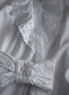 Vintage white lace women's blouse, from the 1990s era Victorian style, white blouse with a lavish ruffle lace front with eyelet floral embroidery and the same lace decorations on the cuffs. Slightly fitted body, looks great tucked into high waist jeans Material - missing tag, probably a cotton-polyester blend Size - marked 40 EU which is M. This is the vintage size, please look at measurements below to see if it will fit you: Approximate Measurements (taken when blouse lying flat, double armpit White Lace Patchwork Cotton Top, Spring Victorian Fitted Blouse, White Cotton Lace Patchwork Top, White Cotton Lace Top With Patchwork, Broderie Anglaise Cotton Lace Top, Elegant Summer Cotton Lace Top, Elegant Cotton Lace Top For Summer, Elegant Summer Lace Top In Cotton Lace, White Summer Blouse With Ruffled Collar