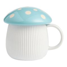 a blue and white mushroom shaped coffee mug