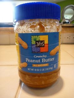 a jar of peanut butter sitting on top of a counter