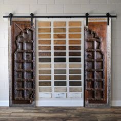 two large wooden doors with decorative designs on them