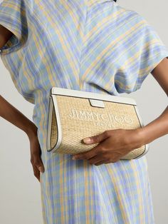 Whether you're attending a beach wedding or dining al fresco on vacation, Jimmy Choo's 'Avenue' clutch is the perfect accessory for balmy summer occasions. It's woven from beige raffia that's embroidered with the brand's logo and trimmed with off-white leather. There's enough space inside for your sunglasses, lip balm and a discovery-size perfume vial. Chic Embroidered Summer Clutch, Embroidered Clutch For Evening In Summer, White Summer Clutch For Formal Occasions, Elegant Embroidered Clutch For Summer, Chic White Clutch For Beach Outing, Chic White Clutch For Beach, White Evening Clutch For Summer, White Summer Evening Clutch, Elegant Summer Vacation Clutch