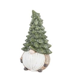 a ceramic christmas tree sitting on top of a ball