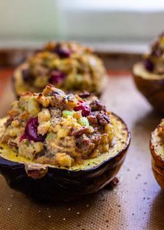 baked stuffed potatoes with stuffing and cranberries on a baking sheet, ready to be eaten