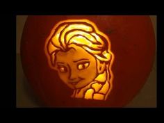 a carved pumpkin with an image of princess aurora in the center and her hair pulled back