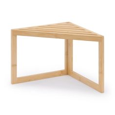 a small wooden table sitting on top of a white floor