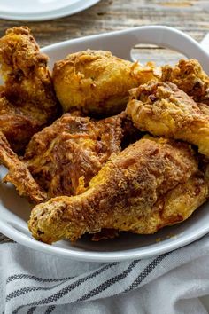 fried chicken in a white bowl on a table