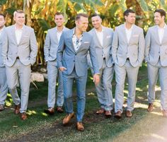 a group of men in suits standing next to each other