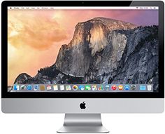 an apple desktop computer with the mountain in the background