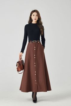 Discover modern elegance in our brown A-line high-waisted wool maxi skirt, thoughtfully designed with button embellishments on the front. The versatile brown shade effortlessly complements various tops. DETAIL * 30% wool, 30% fiber, 40% polyester * Fully satiny liner * Two side pockets * Right zipper closure * Long wool skirt,Maxi skirt * A line skirt,high waist skirt * Formal skirt * Perfect for Winter, autumn * Has belt loops to keep everything in place * Learn More about the items From the FAQs on the page bottom * Dry clean * More color choose No 8: https://etsy.me/4fGTZ6f MODEL SIZE Bust 85 cm(33.4") Waist 67 cm(26.7") Height 168cm (5' 6") She wears size XS Choose CUSTOM Order if you * Need a better fit * Can't find your size in our size Chart * Change the Style * Chang the Length * Y Maxi Long Skirt Outfits, Brown Long Skirt, Edwardian Skirt, Wool Maxi Skirt, Custom Skirt, Long Wool Skirt, Big Skirts, Button Embellishments, Cozy Evening