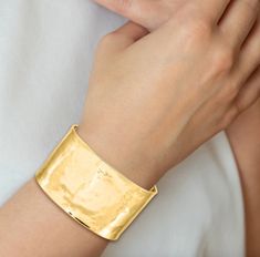 14KT polished yellow gold hammered + textured cuff bangle bracelet. Width: 39mm Weight: 39 grams Open cuff; fits small to large wrists 585/ 14KT purity Elegant Hammered Cuff Bangle, Modern Hammered Cuff Bangle, Luxury Gold Hammered Cuff Bracelet, Luxury Hammered Wide Band Jewelry, Luxury Hammered Bangle Cuff Bracelet, Luxury Hammered Cuff Bracelet, Formal Hammered Yellow Gold Cuff Bracelet, Modern Hammered Cuff Jewelry, Formal Yellow Gold Hammered Cuff Bracelet