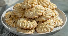 a white plate filled with cookies on top of a table