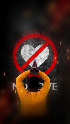 a man with his hands on his head in front of a no love sign