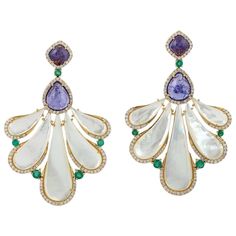 Handcrafted entirely from 18-karat gold, these stunning earrings are set with .97 carats of tanzanite, 25.54 carats mother of pearl and 1.45 carats of glimmering diamonds. FOLLOW MEGHNA JEWELS storefront to view the latest collection & exclusive pieces. Meghna Jewels is proudly rated as a Top Seller on 1stDibs with 5 star customer reviews. All items manufactured by us are handmade and can be customized or redesigned. Composition Size-58X34 MM Total Weight-25.55 Gold Weight(Gms)-18.261 Diamond Wt(Cts)-1.45 Tanzanite Wt(Cts)-0.97 Mother of Pearl Wt(Cts)-25.4 Mop Jewelry, Tanzanite Jewelry, Mother Of Pearl Jewelry, Gold Diamond Earrings, Classy Jewelry, Emerald Earrings, Pearl Earrings Dangle, Stunning Earrings, Top Seller