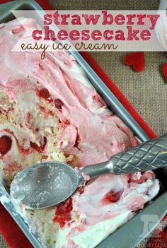 strawberry cheesecake ice cream in a metal pan with a spoon on the table next to it