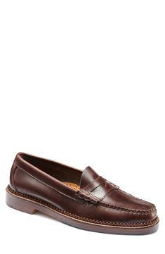 Hand-sewn with premium leather, this penny loafer was built to be worn in heavy rotation and stand the test of time. Leather upper, lining and sole Imported Classic Brown Plain Toe Boat Shoes, Classic Moc Toe Boat Shoes With Stitched Sole, Classic Slip-on Moccasins With Goodyear Welt, Classic Round Toe Moccasins In Bridle Leather, Classic Bridle Leather Moccasins With Round Toe, Classic Brown Boat Shoes For Workwear, Classic Wingtip Boat Shoes With Leather Sole, Classic Moc Toe Boat Shoes, Goodyear Welt Wingtip Moccasins For Semi-formal