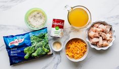 ingredients to make broccoli casserole laid out on a marble counter top