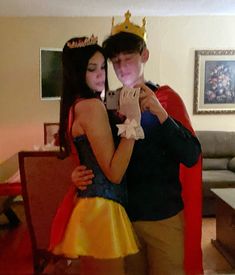 a man and woman dressed up in costumes taking a selfie