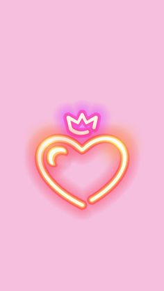 a neon heart with a crown on top