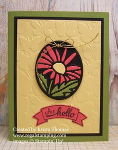 a card with a pink flower on it and a ribbon around the edge that says hello