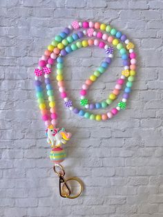 This lanyard is adorable! It is giving Lisa Frank vibes. Perfect for teachers or anyone who wears a lanyard! Multicolor Fun Craft Supplies For Teacher Appreciation, Fun Multicolor Craft Supplies For Teacher Appreciation, Fun Multicolor Adjustable Badge Holders, Fun Multicolor Lanyards For Gifts, Fun Multicolor Lanyards As Gifts, Playful Multicolor Badge Holders For Gift, Personalized Multicolor Fun Badge Holder, Cute Multicolor Lanyard As A Gift, Cute Multicolor Lanyard For Gifts