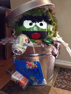 a bucket filled with lots of food sitting on top of a floor