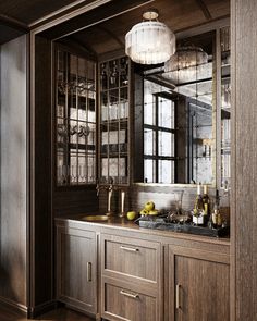 a kitchen with wooden cabinets and marble counter tops, along with an antique style chandelier