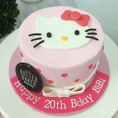 a hello kitty birthday cake on a table