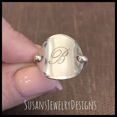 "This ring is made with a 3/4\" disc engraved with a beautiful script single initial in the center. Disc has been shaped to resemble a saddle style ring and will be made to your custom size preference. Wire has been added to make up the band of the ring and the edge of disc has been hammered to add a neat texture. This ring is super comfortable to wear. I can make this ring in rose gold filled, sterling silver (shown), or yellow gold filled. Use the options pull down menu to select your ring siz Adjustable Sterling Silver Signet Ring With Initials, Adjustable Monogram Engraved Sterling Silver Ring, Personalized Silver Signet Ring With Initials, Adjustable Silver Engraved Ring With Initials, Silver Engraved Ring With Monogram For Personalized Gifts, Personalized Silver Oval Initial Ring, Silver Engraved Monogram Ring For Personalized Gift, Personalized Silver Engraved Ring With Monogram, Adjustable Engraved Sterling Silver Ring As Personalized Gift