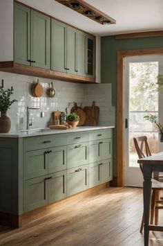 #sherwinwilliams #paintcolors #homeimprovement #interiordesign #colortrends #2024trends #homedecor #graypaint #paintingideas #renovation Small Sage Green Kitchen, Sage Green And Wood Kitchen, Sage Green Kitchen Island, Sage Green Kitchen Decor, Green Kitchen Decor Ideas, Sage Green Kitchen Ideas, Kitchen Island Designs