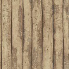 an old wooden fence with peeling paint on it