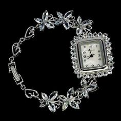 A chic, exclusive 925 sterling silver watch, 14 carat white gold.  Stone: magnificent natural Brazilian aquamarine round in the shape of a marquise with stunning jewelry cut of 3.0 and 8.0 x 4.0 mm. Dial natural mother of pearl movement Japan.  Front part: 32.0x28.0 mm.  Weight: 29.54 g. Length: 7.0 inch.  Price: 500 euros. Bridesmaid Gifts Jewelry, On The Border, Gold Stone, Stunning Jewellery, Bridesmaids Gifts, Silver Watch, Gold And Silver, Gift Item, Bridesmaid Gifts