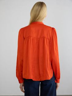 Description:The Roisin blouse is a refined popover top crafted from our wrinkle-resistant Japanese satin. It features full-length, voluminous sleeves, finished with matching natural shell buttons at the cuffs. The front and back yoke has subtle gathering, adding graceful movement and comfort. This blouse looks polished whether worn loose or tucked into pants. Tuck into the Pleated Pull-on Pants for a flowy chic presentation. Size Fit:Model (5’9”) wears a size small Length: 25 1/4"Chest: 20"Sleev