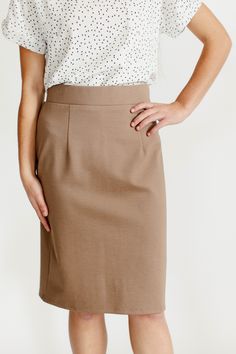 With clean, simple lines and sophisticated style, the 'Anna' is the perfect pencil skirt your closet has been waiting for. Quality fabric, full lining and structured style ensure a modest and flattering fit while an elastic waistband keeps you comfortable. Exclusively designed with you in mind! 68% Rayon 27% Nylon 5% Spandex Hand Wash Cold Separately or With Like Colors Do Not Bleach Hang to Dry Low Iron if Needed 1.75" Waistband Fully Lined ﻿Color may be slightly darker than shown Model Height Flattering Fitted Pencil Skirt For Workwear, Solid Knee-length Skirt For Business Casual, Solid Color Midi Pencil Skirt With Lining, Solid Color Midi Length Lined Pencil Skirt, Solid Midi Length Lined Pencil Skirt, Solid Color Midi Skirt For Workwear, Solid Midi Length Skirt For Workwear, Midi Length Skirt For Workwear, Classic Fitted Midi Pencil Skirt