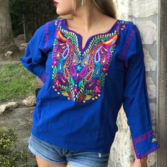 Look Fan-Tas-Tic In This Stunning Mexican Blouse! Embroidered With A Vibrant, Colorful Peacock Design, This Beauty Will Make Heads Turn. Plus, It's Tailored With A Comfy V-Neck, 3/4 Sleeves, And Tassels, All Crafted With A Breathable Cotton Blend And Matching Accents For A Poppin' Look. Make 'Em Quack In Envy! Photos Shown Are A Representation Of The Blouse You Will Receive, Fabric Color Is The Same But Embroidery Color Or Design May Vary. This Is Because Each Blouse Is Individually Handmade Whi Embroidered Peacock, Colorful Peacock, Royal Blue Top, Designer Embroidery, Mexican Blouse, Mexican Fashion, Gorgeous Blouses, Peacock Design, Top Plus Size