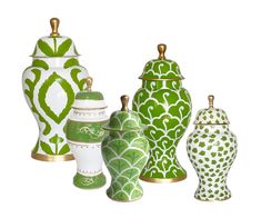 a group of green and white vases sitting next to each other